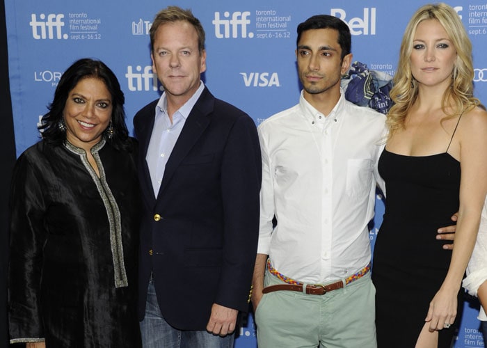 From left, director Mira Nair, actor Kiefer Sutherland, actor Riz Ahmed and actress Kate Hudson participate in a photo call and press conference for the film "The Reluctant Fundamentalist" at the Toronto Film Festival.