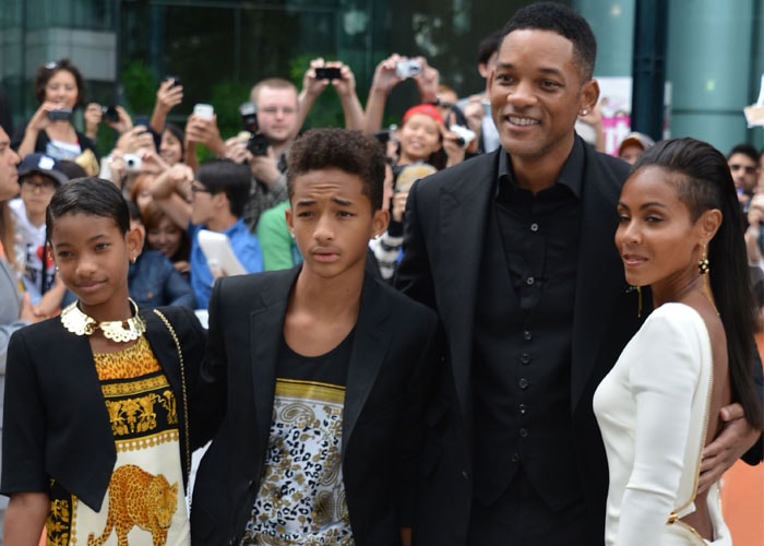 Actor Will Smith, his actress wife Jada Pinkett Smith with their children Willow and Jaden at the <i>Free Angela & All Political Prisoners</i> premiere during the Toronto International Film Festival. Jada looks smashing in her white dress while the children look stylish in their animal-print dresses.