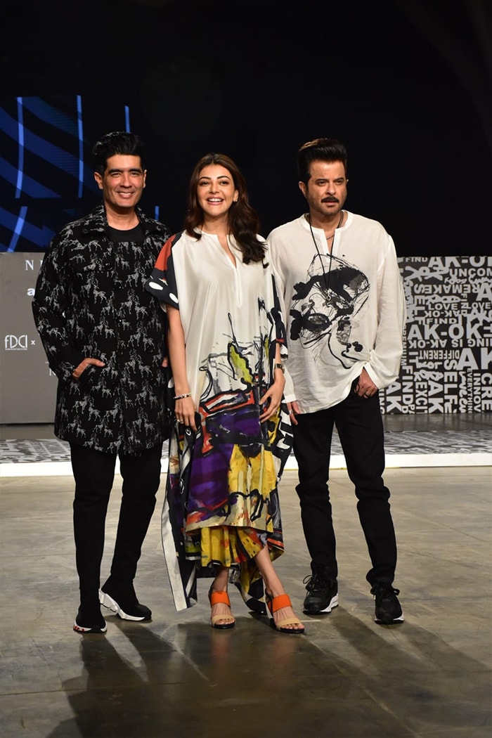 Kajal Aggarwal happily posed with actor Anil Kapoor and designer Manish Malhotra on the ramp.