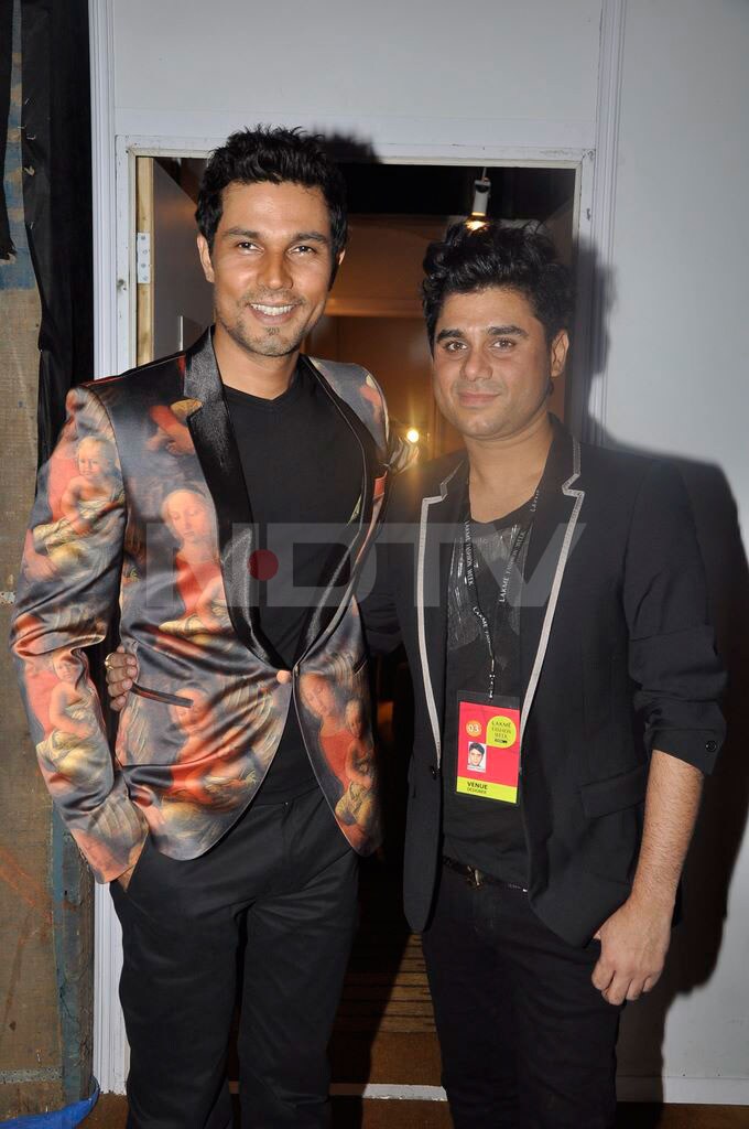 Randeep Hooda posing with designer Rajat Tangri.