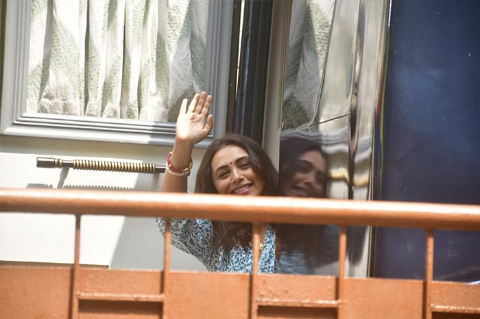 An outfit change later, Rani Mukerji peaked out of her vanity to greet the fans and paparazzi.