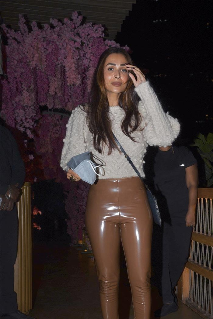 For dinner with sister Amrita Arora and designer Vikram Phadnis, Malaika Arora wore leather pants and a sweater with boots