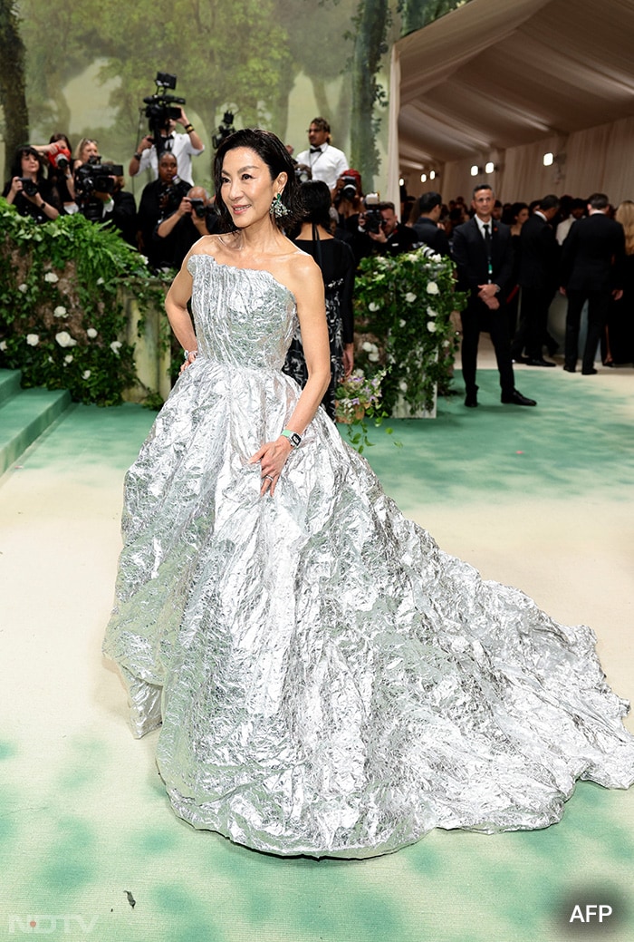 Michelle Yeoh was spotted wearing a silver Balenciaga gown on the red carpet. (Image courtesy: AFP)