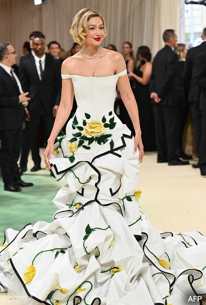 Gigi Hadid was seen wearing a white custom Thom Browne gown. (Image courtesy: AFP)