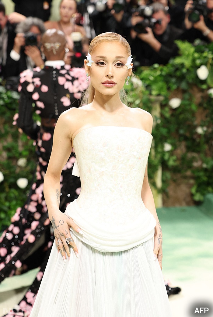 Ariana Grande looked lovely in this white ensemble from the house of Loewe. (Image courtesy: AFP)