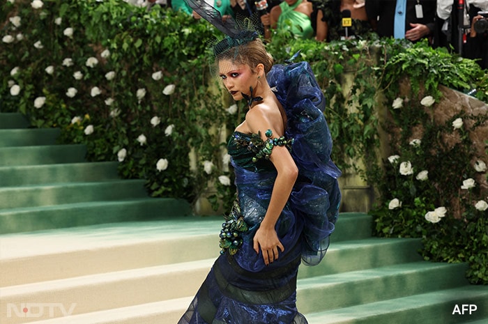 For her first red carpet appearance, Zendaya wore an iridescent electric blue fishtail gown by John Galliano. (Image courtesy: AFP)