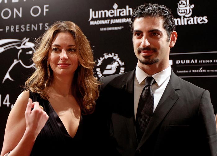 Fahd Hariri, son of late Lebanese Prime Minister Rafiq Hariri, poses with his wife Maya on the red carpet.