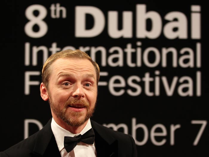 English actor Simon Pegg poses on the red carpet.