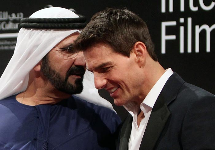 Tom Cruise listens to Prime Minister of the United Arab Emirates and Dubai ruler Sheikh Mohammed bin Rashed al-Maktoum upon arrival at the opening ceremony of the Dubai International Film Festival (DIFF).