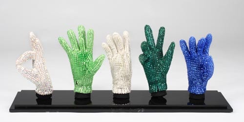 Michael Jackson's signature crstyal glove in five different colors. The gloves are identical to those worn by Jackson throughout his career but have been mounted to custom posed mannequin hands.