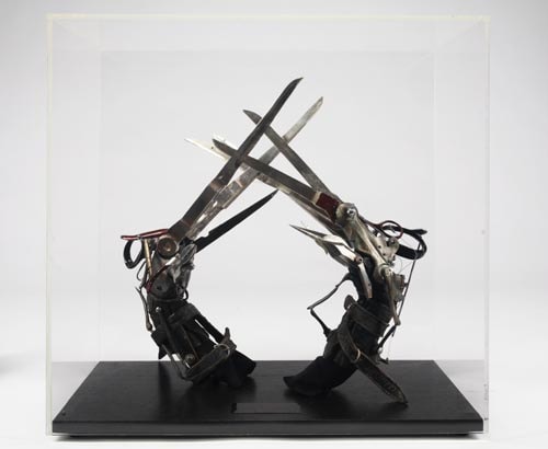 A pair of the prop 'scissorhand' gloves that Johnny Depp wore as he portrayed the title character in Tim Burton's <I>Edward Scissorhands</i>. The gloves are owned by Michael Jackson.