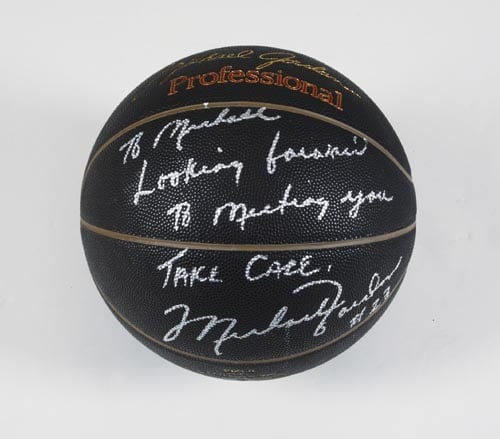 A basketball inscribed to Michael Jackson from basketball star Michael Jordan up for sale at the auction.