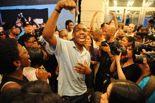 After hearing of the death of pop star Michael Jackson, people gather and sing in New York.