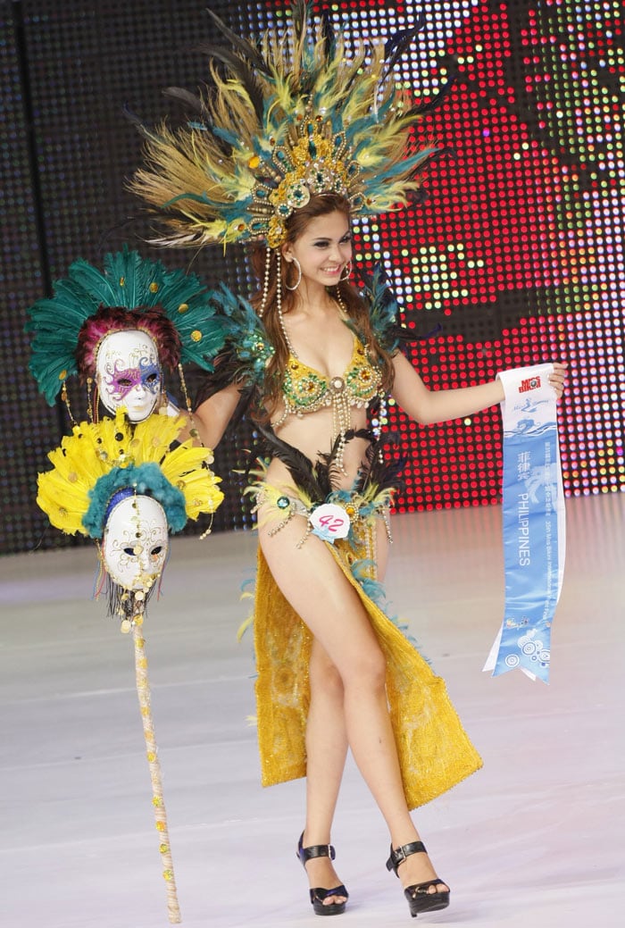 Contestants parade during the 35th Miss Bikini International World final in Sanya, south China's Hainan province on May 29, 2010. Miss Romania Diana Irina Boanca was crowned the winner in the ten-day competition that a total of 64 contestants took part in. (PHOTO: AFP)