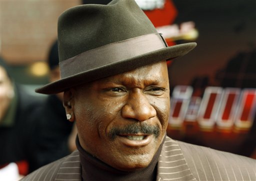 Actor Ving Rhames poses for photographers on the red carpet at a VIP screening of the new film in which Rhames stars, Mission: Impossible lll at the Magic Johnson Theater in New York.