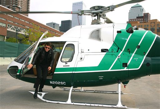 In this photo provided by Paramount Pictures,Tom Cruise jumps out of a helicopter to get on a motorcycle before driving to the Tribeca Film Festival for the first screening of Mission Impossible III during the Tribeca Film Festival in New York.