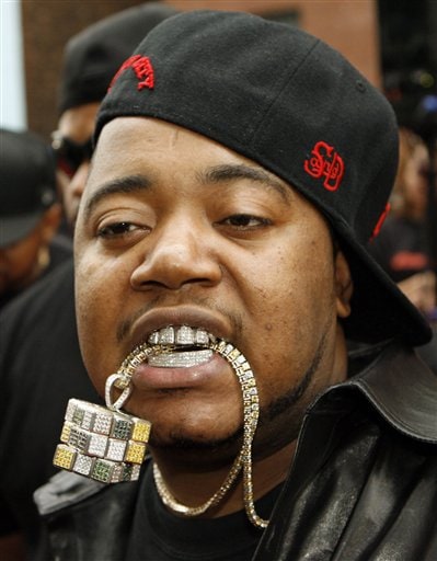 The rapper known as Twista displays his jewellery for photographers on the red carpet at a VIP screening of the new film, Mission: Impossible lll in New York.