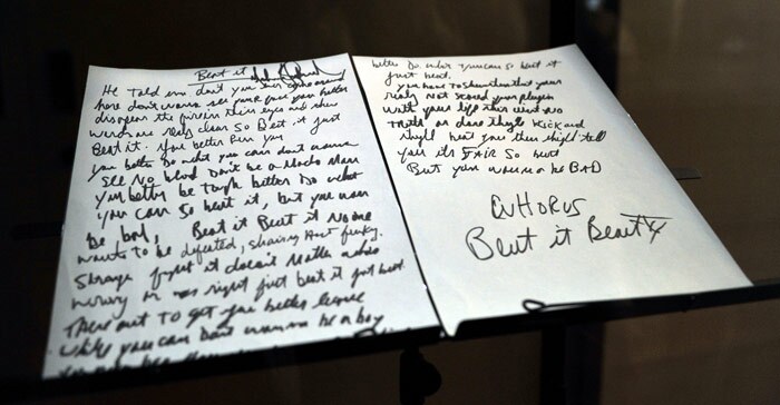 View of a copy the lyrics of the 'Beat It' song handwritten by late pop singer Michael Jackson himself, on display at the Fashion Museum in Santiago. (Photo: AFP)