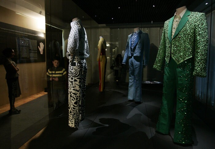 Fans look at clothing worn by the late Michael Jackson on display at the Museum of Fashion in Santiago. (Photo: AFP)