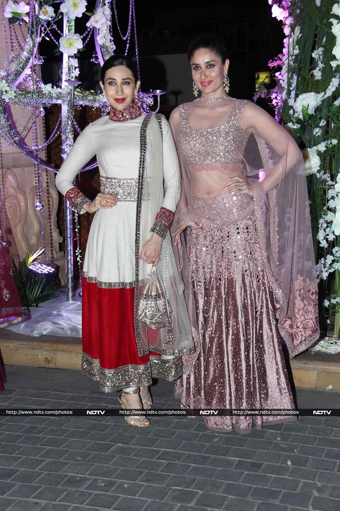 The Kapoor sisters, Kareena and Karisma, long time fans of Manish Malhotra also wore his outfits with Karisma opting for a long white and red suit and Kareena, a pink <i>lehenga</i>.