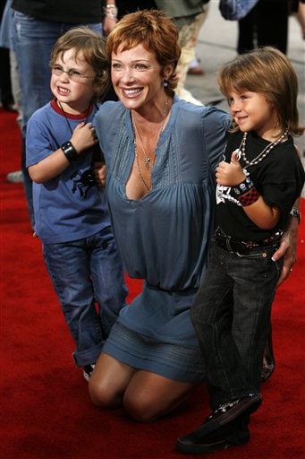 Actress Lauren Holly and her sons George, left, and Azer arrive for the premiere of the film Monster House in Los Angeles.