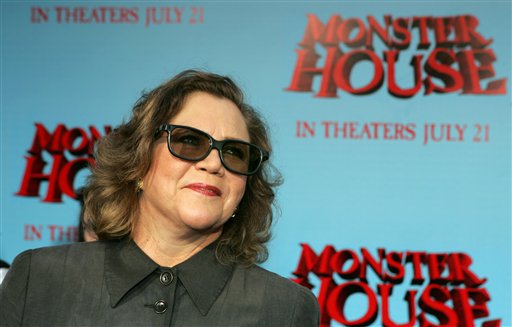 Actress Kathleen Turner poses wearing 3-D glasses that are used to experience the film Monster House as she arrives for its premiere.