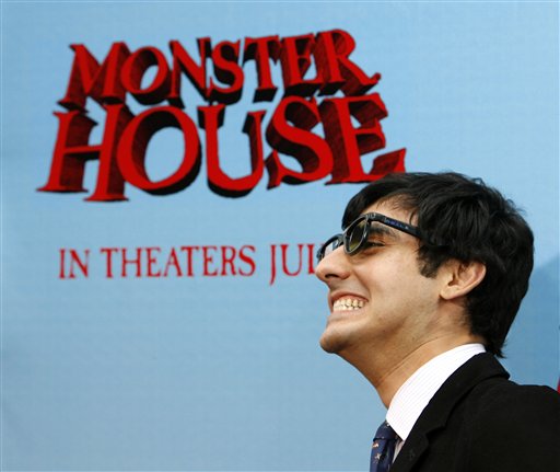 Director Gil Kenan poses wearing 3-D glasses that are used to experience his film Monster House as he arrives for the premiere in Los Angeles.