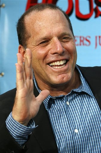 Producer Jack Rapke waves on the red carpet as he arrives for the premiere of the film Monster House in Los Angeles.