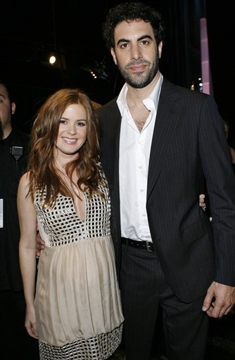 Sacha Baron Cohen and his fiance Isla Fisher pose backstage during the MTV Movie Awards in Los Angeles.