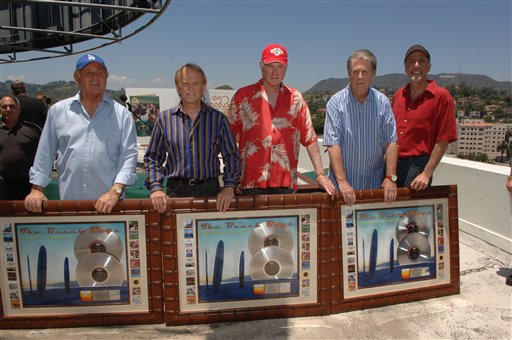 In this photo released by Capitol/EMI, The Beach Boys, Bruce Johnston, Al Jardine, Mike Love, Brian Wilson, and David Marks, from left, pose together on the rooftop of Capitol Records in Los Angeles.
