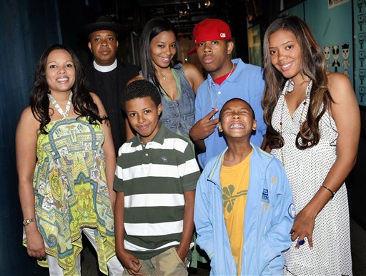 Joseph Simmons, second left, formerly of Run-DMC, poses with his family backstage during MTV's Total Request Live at the MTV Times Square Studios in New York.  Pictured with Rev Run are, from left, his wife Justine, son Diggy, daughter Vanessa, son JoJo, rear, son Russel Jr. and daughter Angela.
