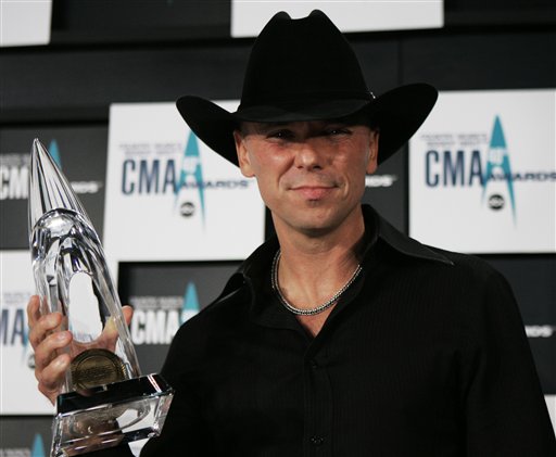 Kenny Chesney holds the Entertainer of the Year award, backstage at the 40th Annual CMA Awards in Nashville.