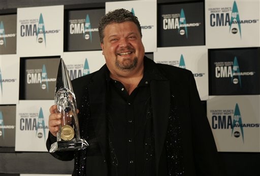 Craig Wiseman holds the award for his work on Song of the Year for his work on Believe at the 40th Annual CMA Awards in Nashville.