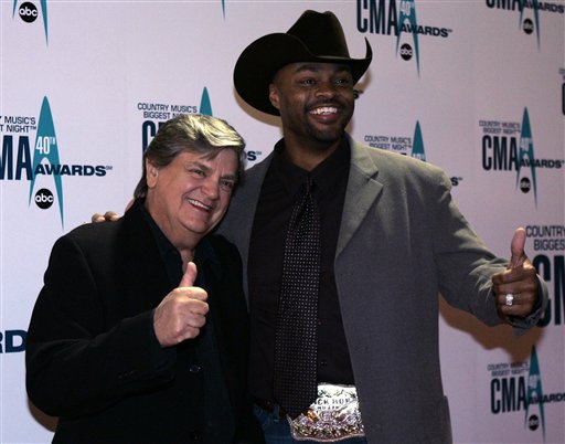 Phil Everly, left, and Cowboy Troy arrive at the 40th Annual CMA Awards in Nashville.