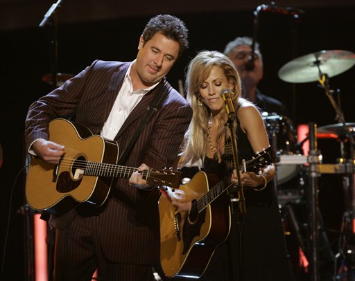 Vince Gill, left, and Sheryl Crow perform at the 40th Annual CMA Awards in Nashville.