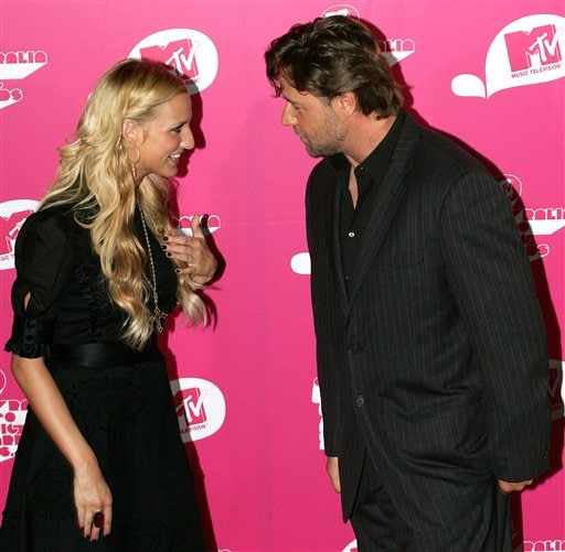 Ashlee Simpson, left,  meets Russell Crowe as they arrive for the MTV Australia Music Video Awards in Sydney, Australia.