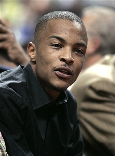 Rap artist T.I. sits courtside at the Milwaukee Bucks-Detroit Pistons Game 2 of the Eastern Conference first-round NBA playoff basketball game in Auburn Hills. T.I., whose real name is Clifford Harris, plans to resume his national tour in New Orleans, a week after the fatal shooting of his personal assistant and the wounding of three others in the rapper's entourage following a show in Cincinnati.