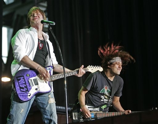 Goo Goo Dolls' John Rzeznik, left, and Robby Takac perform  in Miller Park stadium in Milwaukee. A failure in an underground electrical line in Mount Clemens, Mich., apparently caused a series of gas explosions that sent utility hole covers flying and forced cancellation of the group's concert, officials say.
