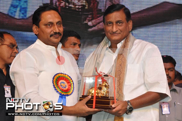 Producer Adi Seshagiri Rao receives award from the Chief Minister.