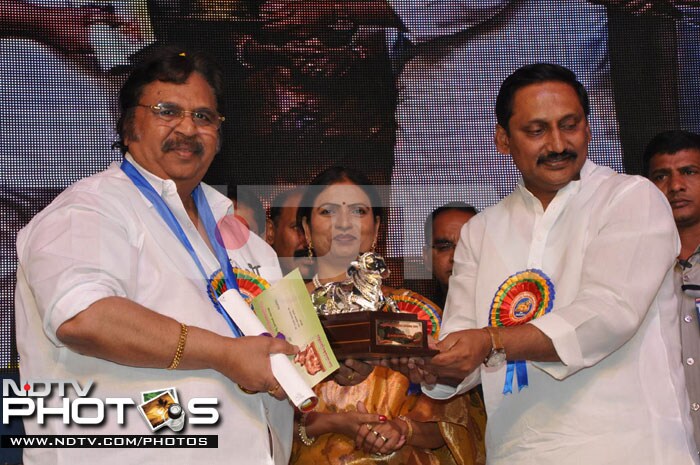 Actor, producer and director Dasari Narayan Rao collects his award from the Chief Minister.