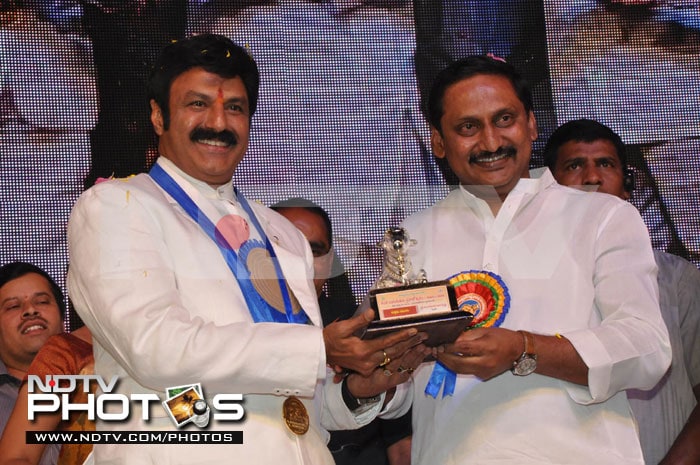 Superstar Nandamuri Balakrishna poses with his award.