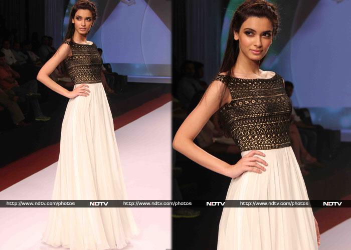 <i>Cocktail</i> actress Diana Penty looked ethereal in a white gown with black lace bodice, when she walked the ramp for Drashti Sarvaiya.