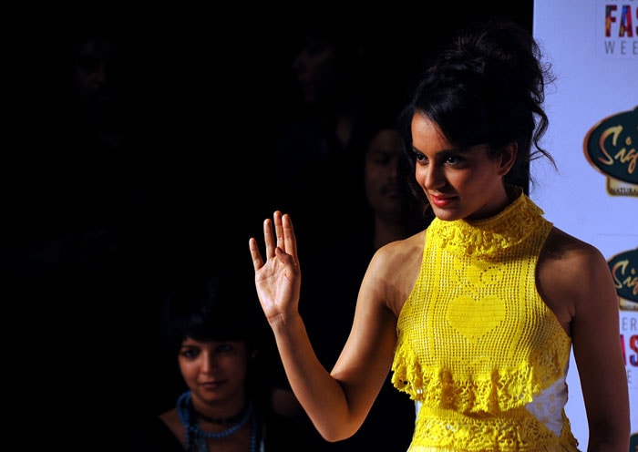 Kangana waves out to the front row.