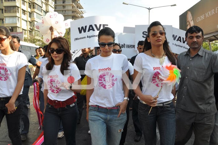 Bollywood stars Neha Dhupia, Minissha Lamba and Mugdha Godse protest against domestic violence on women.