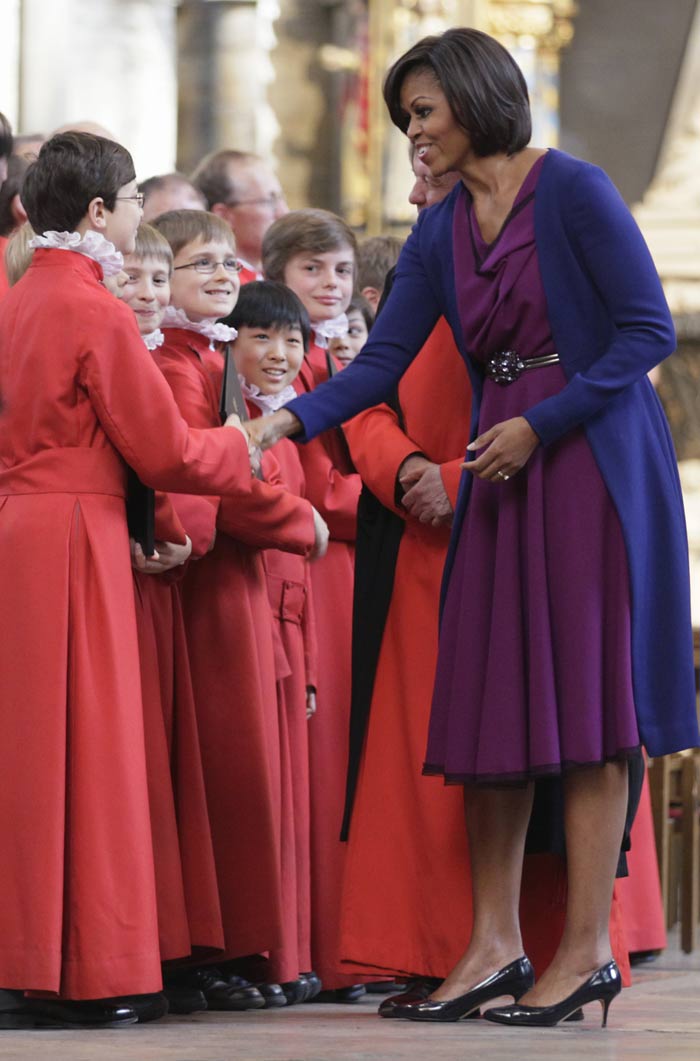 Mrs. O's resort look made way for a magenta Roksanda Ilincic dress with a cobalt blue Narciso Rodriguez coat.