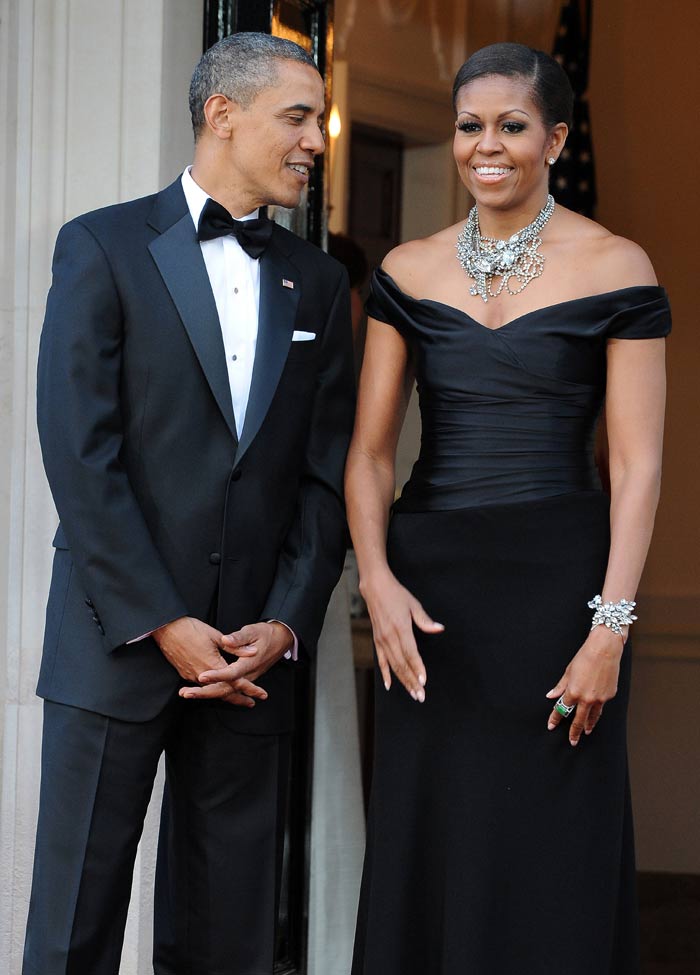 The First Couple share a moment as they wait for their royal guests.