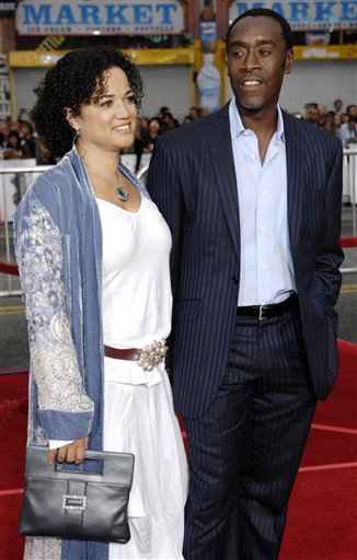 Don Cheadle, right, a cast member in Ocean's Thirteen, arrives with his wife Bridgid Coulter at the premiere of the film at Grauman's Chinese Theatre in Los Angeles.