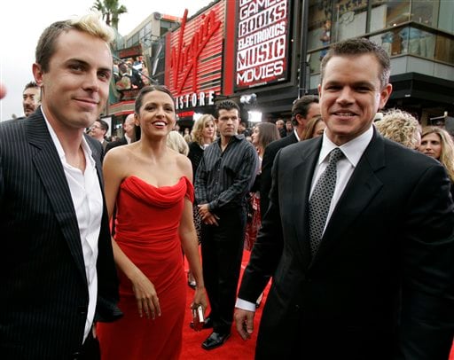 Casey Affleck, left, Matt Damon, right, and Damon's wife, Luciana Barroso, arrive at the premiere of Ocean's Thirteen held at Grauman's Chinese Theatre in Los Angeles.