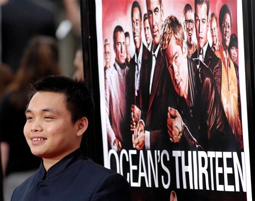 Chinese actor Shaobo Qin, a cast member in Ocean's Thirteen, poses at the Los Angeles premiere of the film at Grauman's Chinese Theatre.