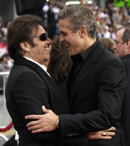 Al Pacino, left, and George Clooney share a moment during the premiere of Ocean's Thirteen held at Grauman's Chinese Theatre in Los Angeles.